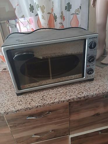 corek qizardan: Luxell elektrik mini soba - Kompakt stolüstü dizayn, ön şüşə qapı və — 1