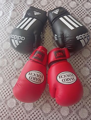 Спортивный инвентарь: Boks əlcəkləri dəsti - Marka və model: 1 cüt Adidas (qara), 1 cüt — 1