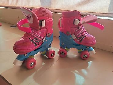 roller skates: Uşaq dördtəkərli konkisurətləri (roller skates).təp təzədi.2 dəfə — 1