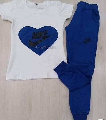 nike suknja: Ženski sportski komplet majica i donji deo trenerke sa dzepovima. Bela — 3