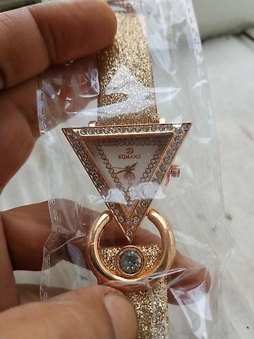 gunuş saat: Qadın qol saatları – 2 fərqli model 1) Qızılı “serpantin” qolbaqlı — 4