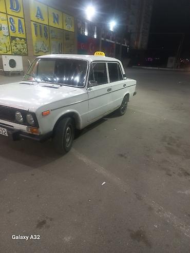 opel astra k: Ağ rəngli VAZ 2106 sedan – klassik model. Şəhər içi sərnişin — 2