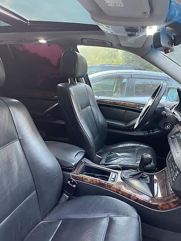 tesla model x: BMW X5 (E53) – qara rəngli, tam ölçülü premium SUV. Texniki və dizayn — 7