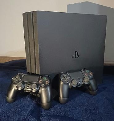PlayStation 4 Pro (черный) + 2 беспроводных контроллера DualShock 4 +