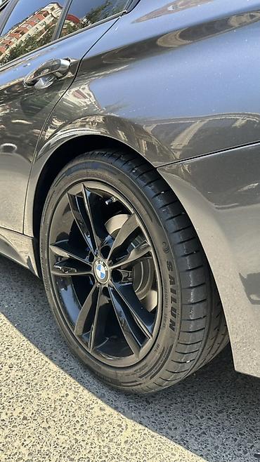 sailun teker: BMW üçün orijinal qara yüngül lehimli disklər və yay təkərləri dəsti — 2