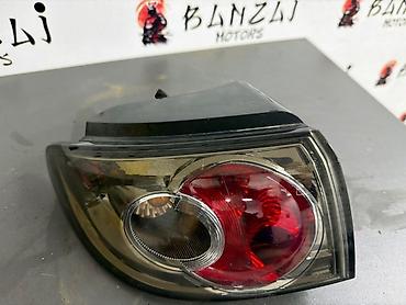 демио авариний: Задний левый стоп-сигнал Mazda 2005 г., Б/у, Оригинал, Япония — 1