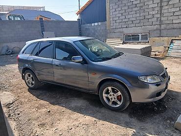 пф 021: Mazda 323: 2003 г., Механика, Бензин, Универсал — 3