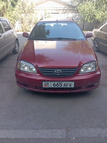 прадо жип: Универсал Toyota Avensis в бордовом цвете. Оборудован рейлингами на