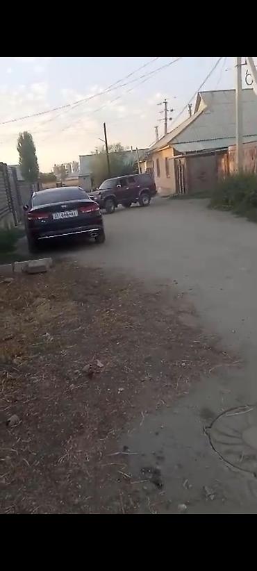 4х4 афто: Полноприводный внедорожник бордового цвета с запасным колесом — 3