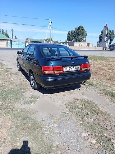 дайхатсу мира: Toyota Carina E: 1996 г., Механика, Бензин, Седан — 4