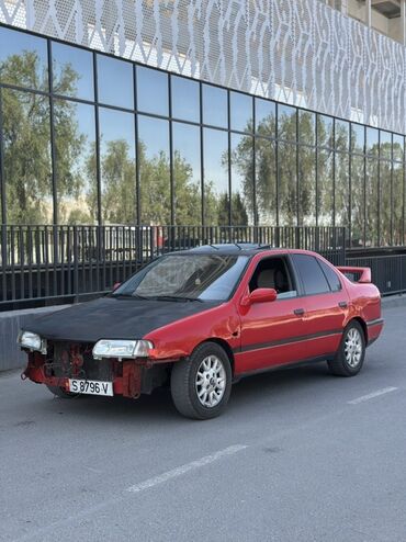 диск шевроле круз: Красный седан Nissan с черным капотом и спойлером на крышке багажника
