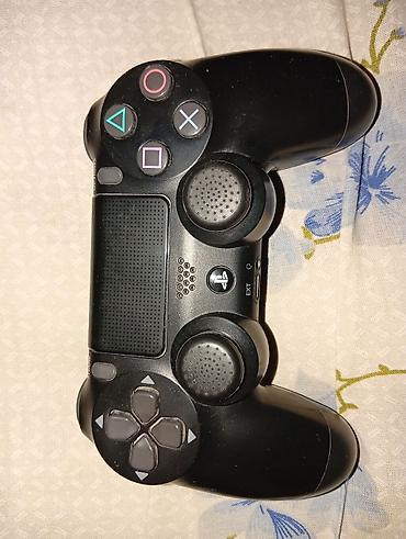 dualshock: Беспроводной геймпад Sony DualShock 4 (PS4), цвет черный. Особенности — 1