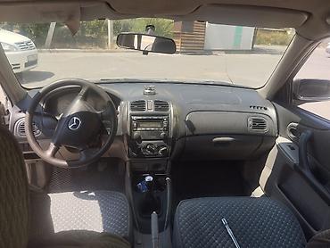 Унаа: Mazda 323: 2003 г., Кол менен иштөөчү, Бензин, Универсал — 6