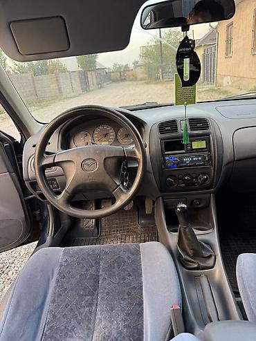 Унаа сатуу: Mazda 323: 1999 г., 1.6 л, Кол менен иштөөчү, Бензин, Седан — 9