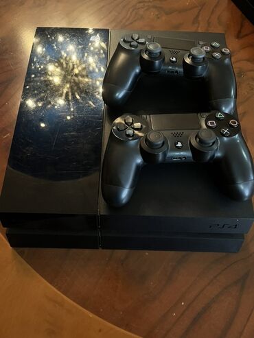 игры на ps4: Qara rəngli PlayStation 4 oyun konsolu. Komplektə iki ədəd DualShock 4