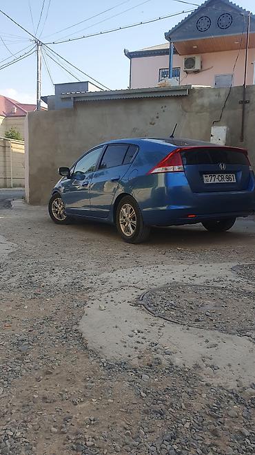 165 60 14: Honda Insight hibrid hetçbek, mavi rəngdə təqdim olunur. Avtomobilin — 1