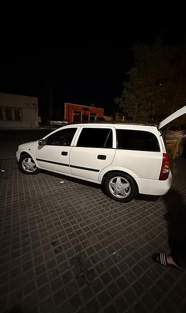 opel astra maşın: Opel Astra Caravan (ağ), universal kuzov - Geniş yük və sərnişin — 9