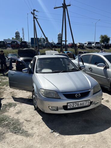 машина х5: Mazda Familia: 2003 г., 1.5 л, Автомат, Бензин, Седан