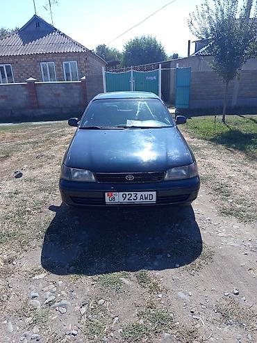дайхатсу мира: Toyota Carina E: 1996 г., Механика, Бензин, Седан — 1