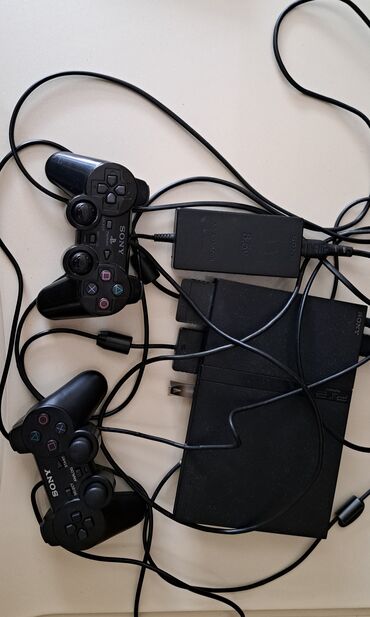 Video oyunlar və konsollar: Playstation 2 fleşka ilə işləyən. İstədiyiniz oyunu yazmaq olar