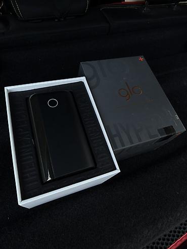 Glo Hyper+ tütün qızdırma cihazı – Rəng: qara, kompakt korpus, yan