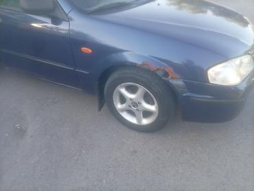222 кузов: Mazda Familia: 2000 г., 1.5 л, Механика, Бензин, Седан — 3