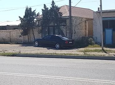 bmw e46 mator: BMW 5Series (E39) sedan – qara rəngdə, klassik biznes sinfi — 2