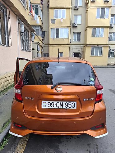 генератор фольксваген: Nissan Note e-POWER, narıncı rəngli, şəhər üçün ideal hibrid (benzin — 8