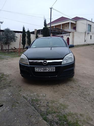 Opel: Opel Astra H Caravan (Universal) – qara rəng, salon və yük yeri geniş — 8