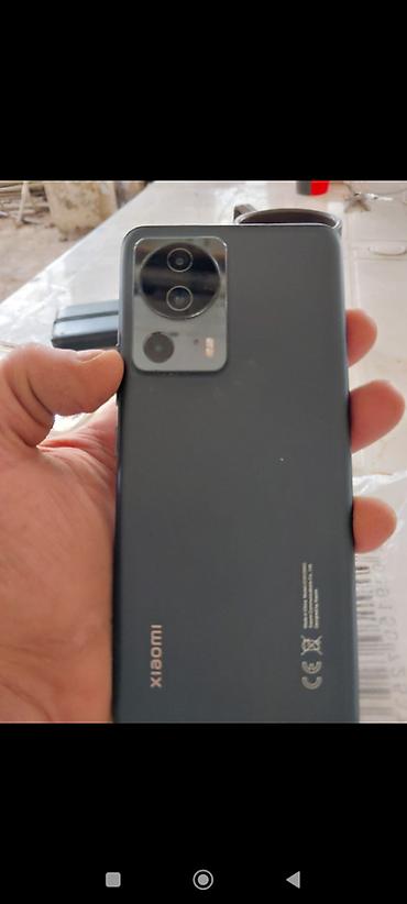 xiomi 14 lite: Xiaomi 13 Lite, 128 GB, rəng - Qara, 
 Face ID, Barmaq izi — 2