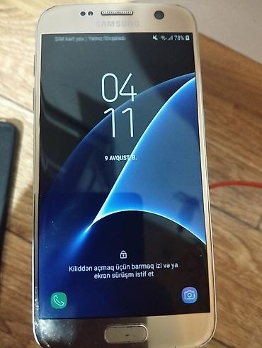 хвох сериес с: Samsung Galaxy S7 Edge Duos 2016, 64 ГБ, цвет - Золотой, Две SIM карты, Кнопочный, Отпечаток пальца — 1
