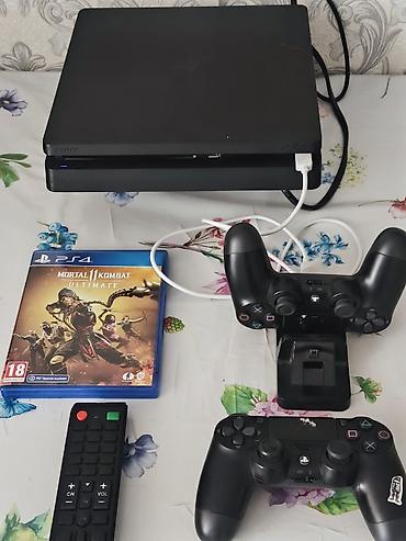 диски для игр: PlayStation 4 Slim (черная) Комплектация: - Консоль PS4 Slim - 2 — 1