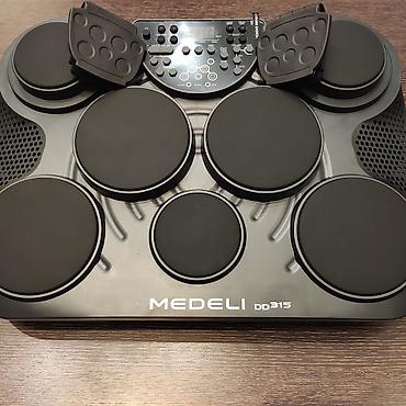 elektro gitarlar: Elektro baraban Medeli DD 315 Musiqilər:100 Səslər:265 Səs yazdırıcı:+ — 1
