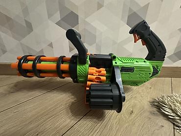 Игрушки: Игрушечный бластер-миниган с вращающимся барабаном В комплекте не — 1