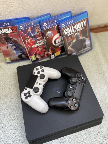 PS4 (Sony Playstation 4): İdeal vəziyyətdə ps4 slim 1tb yaddaşlıdır. Üzərində 2 oyun pultu, 4