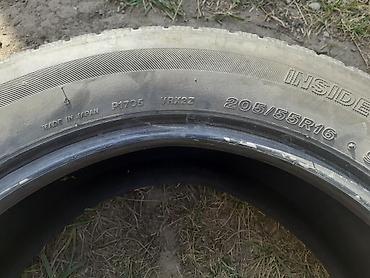 Автомобильная шина 205/55 R16. На боковине указаны: - размер: 205/55