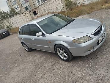 e53 amg: Mazda 323: 2003 г., 1.5 л, Механика, Универсал — 9