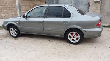 Iran Khodro: Samand sedan – benzinli, ön ötürücülü. Gümüşü rəng.nömrə nişanı — 6