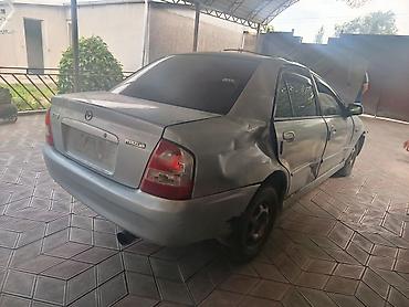 Mazda: Mazda 323: 2002 г., 1.6 л, Механика, Бензин, Седан — 4