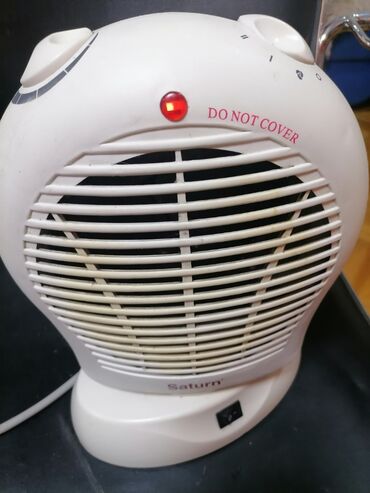 Kaloriferi: Grejalica duvaljka 2 brzine plus ventilator Saturn 2000w Okreće pri — 7