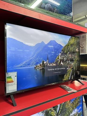 Телевизор с большим экраном (примерно 55–65"), тонкие рамки