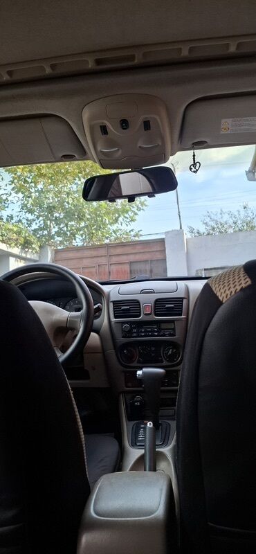 ниссан запчасти: Nissan Sunny sedan – geniş salonlu, komfortlu şəhər və uzun yol