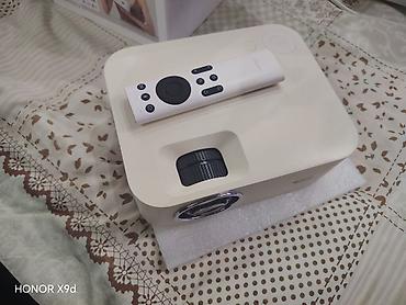 держатель наушников: Проектор Wanbo Projector (модель WB-TXL) - Компактный проектор с — 2