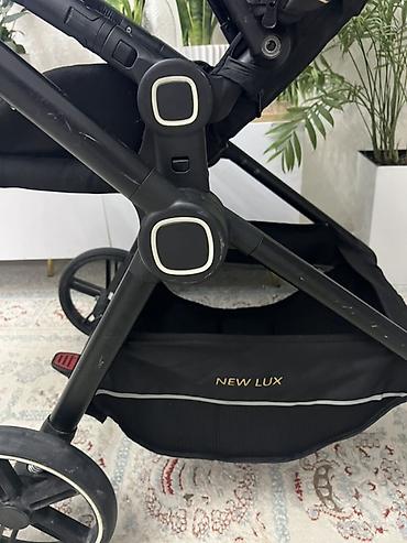 Коляска прогулочная NEW LUX - Легкая маневренная рама с поворотными