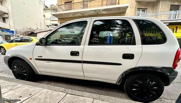 Transport: Opel Corsa: 1 l | 1997 year | 128090 km. Hatchback
