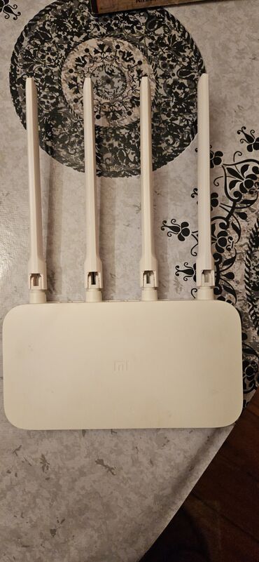 Принтеры: Xiaomi Mi Router 4A. Model 4A, iki tezlik diapazonunda işləyir: 2.4