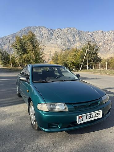 плуг для мтз трактора: Mazda 323: 1997 г., Механика, Бензин, Седан — 3