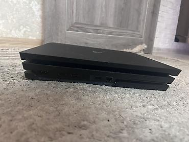 пл: Игровая приставка Sony PlayStation 4 Pro. Модель в фирменном черном — 2