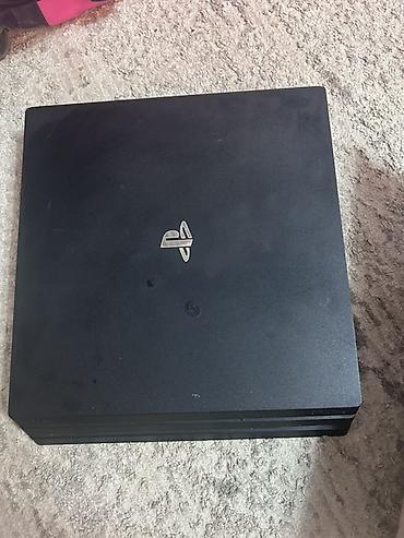 пл: Игровая приставка Sony PlayStation 4 Pro. Модель в фирменном черном — 5