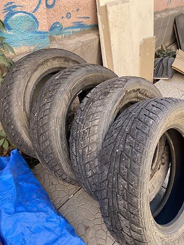 952 2: Комплект шин (4 шт.) - Модель: Dunlop Grandtrek SJ6 (надпись — 1